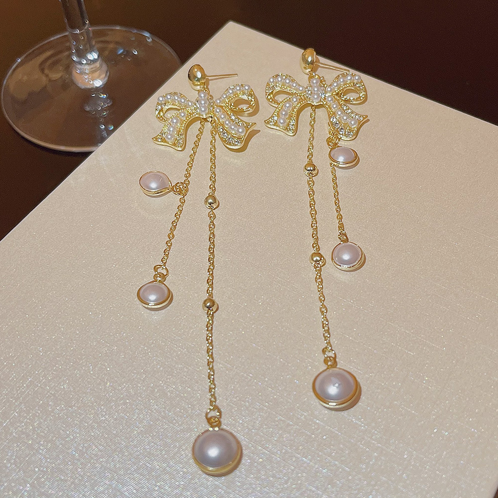 Korean style fashion socialite style pearl full diamond bow earrings with tassels, high-end long and exquisite earrings for women wholesale details Picture