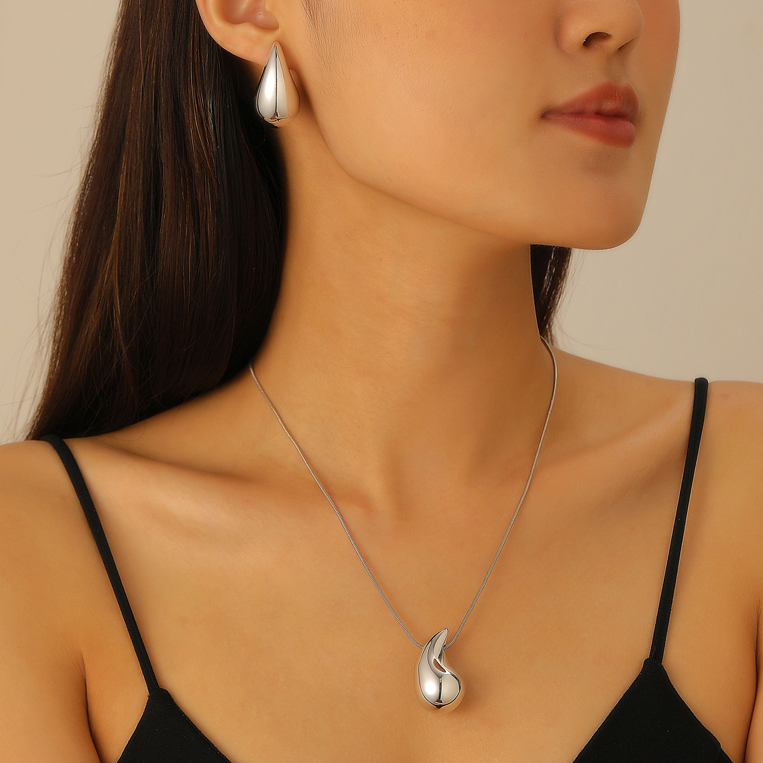 A four-piece set of fashionable electroplated ear hook rings and jewelry, featuring water-drop ear stud necklaces and necklaces that are selling well in Europe and America details Picture