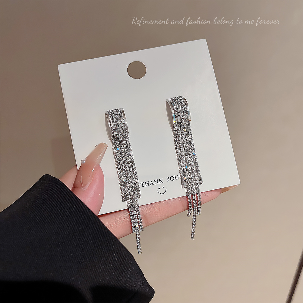 The design sense full diamond tassel earrings, a new trendy ear accessory for women in 2025, exude a gentle and elegant, high-end and light luxury charm full figure