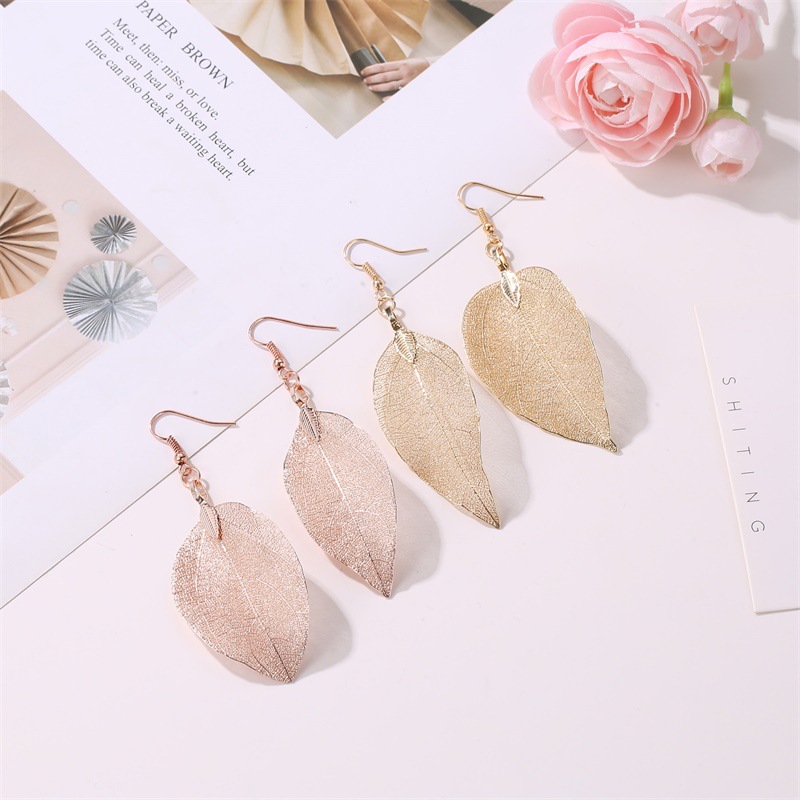 New retro earrings from Europe and America for women, long, hollowed-out leaf earrings, asymmetrical earrings, cross-border wholesale supply details Picture