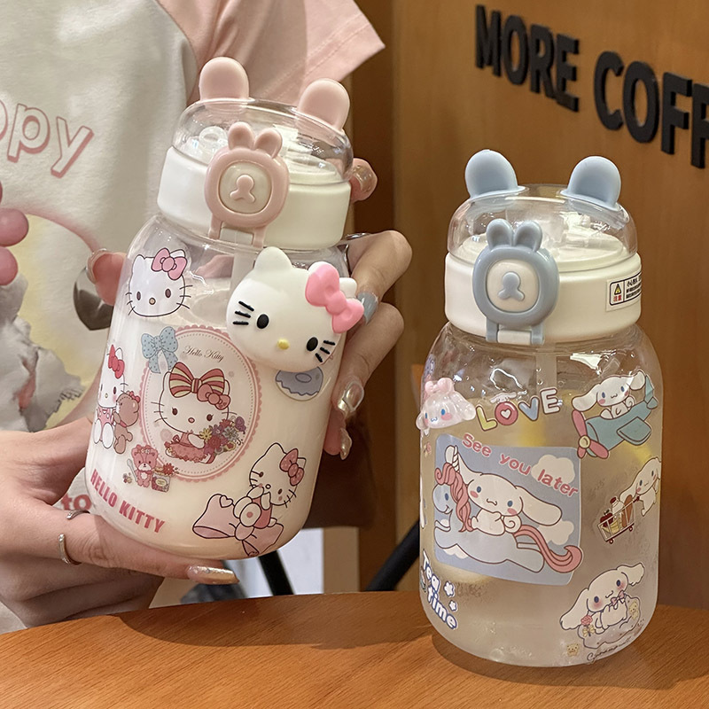 This is a new type of portable plastic cup with a cute three-dimensional sticker and a cartoon character for young girls, featuring a straw and rabbit ears full figure