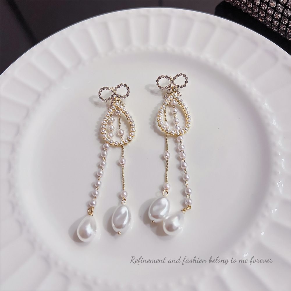 S925 Silver needle Korean version diamond-encrusted bow earrings, exaggerated and personalized irregular pearl tassel earrings and earrings wholesale Application Scenario