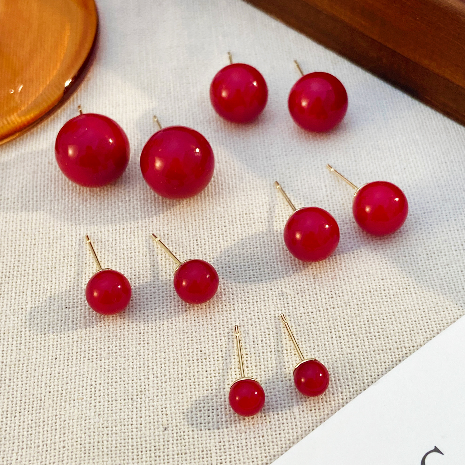 Retro Hong Kong-style red stud earrings for women, New Year's charm earrings, fashionable commuting Ankela red cherry bean stud earrings Application Scenario