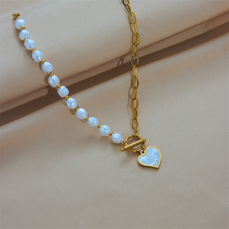 European and American fashion niche design titanium steel pearl chain asymmetrical splicing OT clasp collarbone chain heart pendant necklace details Picture