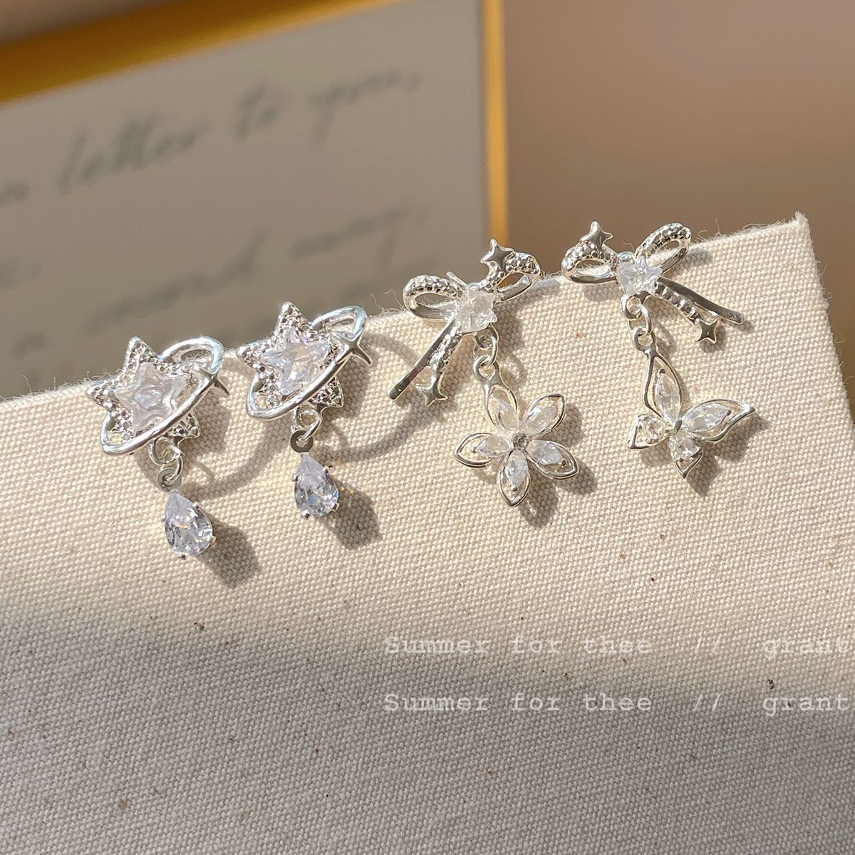 Korean version zircon bow star earrings, women's silver needle, niche design, simple and exquisite, versatile, light luxury earrings Application Scenario