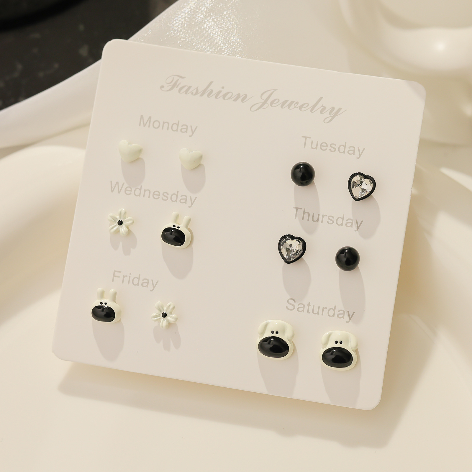 Cool Black new simple and cold style stud earrings set, versatile spotted bow earrings, personalized and elegant earrings wholesale Specification drawing