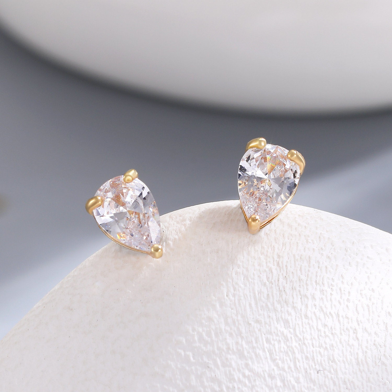 Cross-border copper-inlaid zircon ear studs, a light luxury and high-end women's ear accessory, versatile, simple, small and exquisite. Wholesale of small and niche ear studs Application Scenario