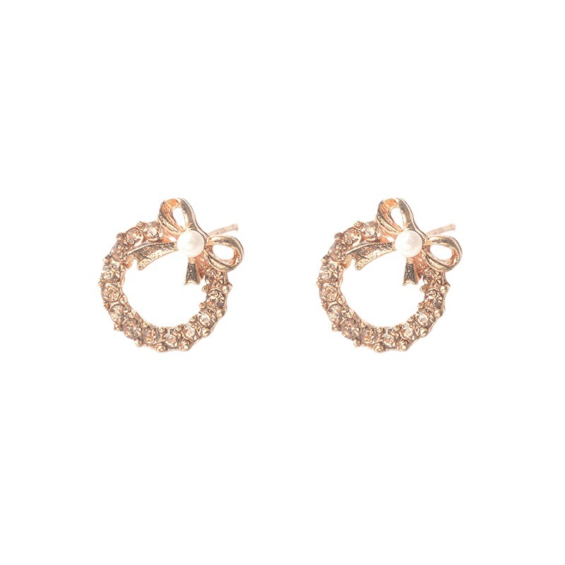 European and American inS-style pearl bow stud earrings, women's unique and elegant style, studded with colorful diamonds, hollowed-out round earrings, cross-border earrings Item Picture
