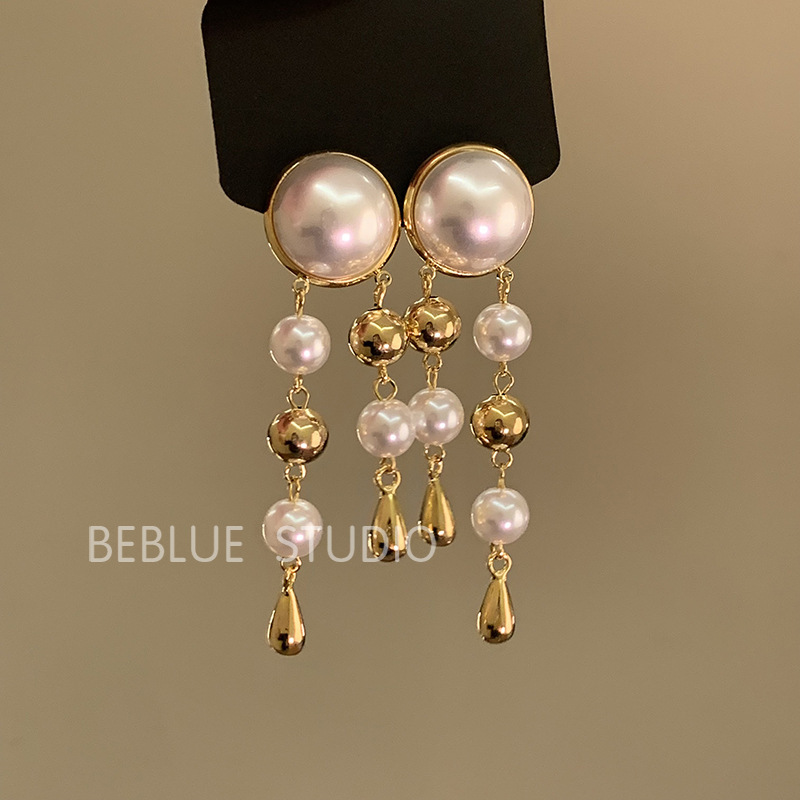 Ethnic-style Miao silver tassel earrings for women, 2024 new high-end stud earrings, new Chinese-style ancient-style horse face skirt earrings Application Scenario