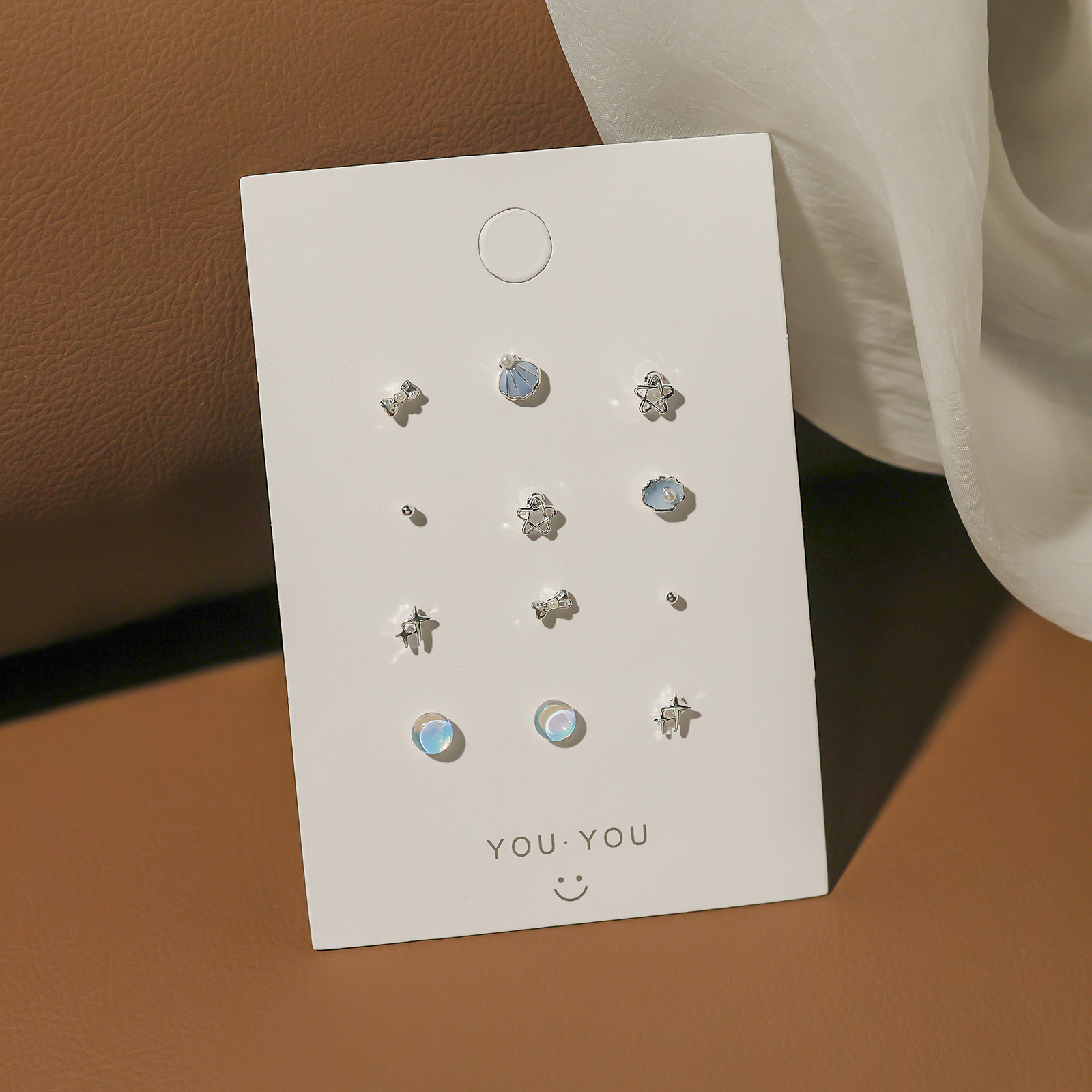 A small and exquisite silver needle stud set in sea blue, versatile and simple daily earrings, personalized and elegant earrings for women wholesale Application Scenario