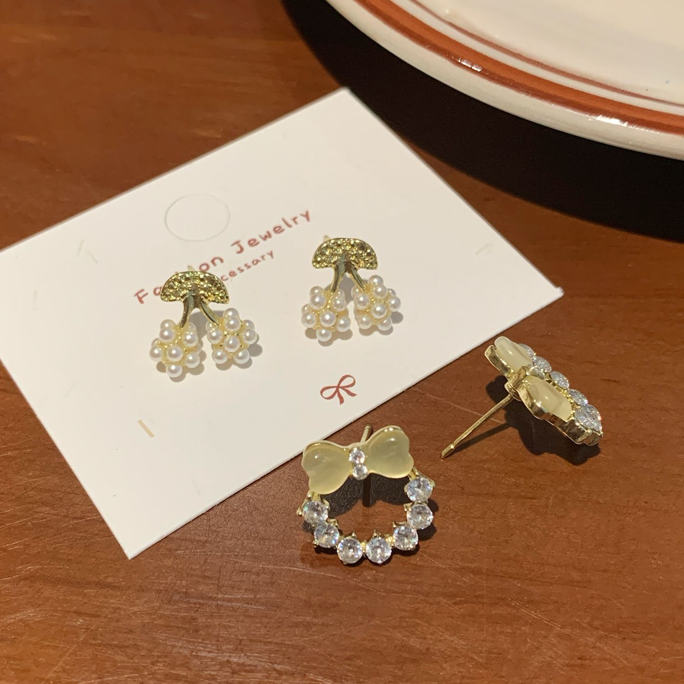 Spring Korean-style exquisite cat's eye stone bow pearl ring stud earrings, women's silver needle diamond-encrusted high-end and elegant earrings Application Scenario
