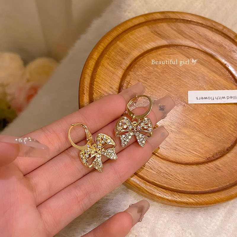 Korean-style full-diamond hollowed-out bow earrings for women, a light luxury, super ethereal, high-end and unique personality bestseller full figure