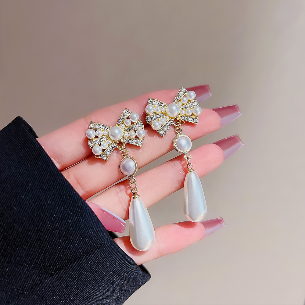 Long tassel pearl earrings, fashionable and elegant lady style, light luxury bow earrings, silver needle high-end earrings, women's wholesale details Picture