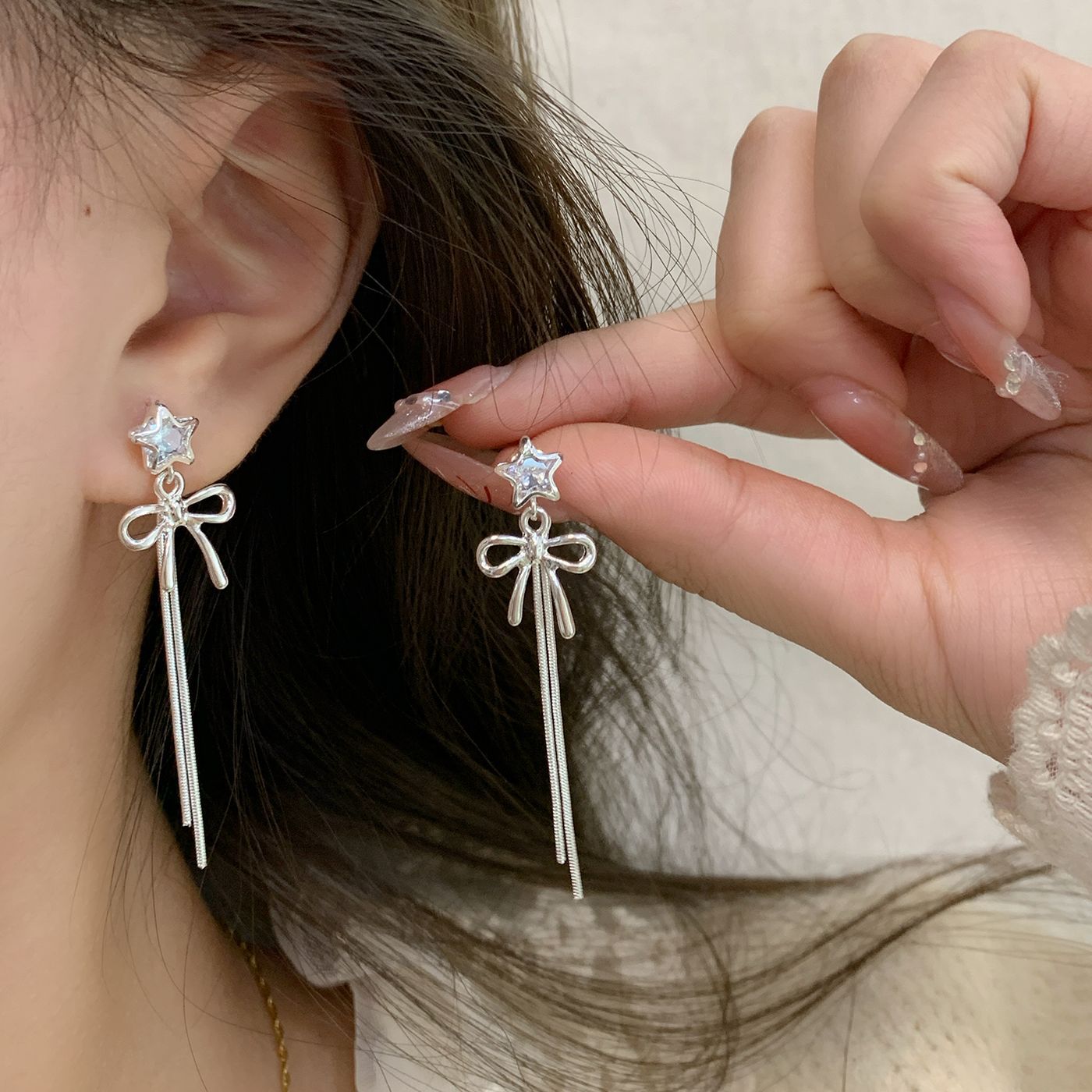 Fashionable and simple plain silver bow long tassel earrings, silver needle stars for women, sweet and girlish, face-slimming earrings details Picture