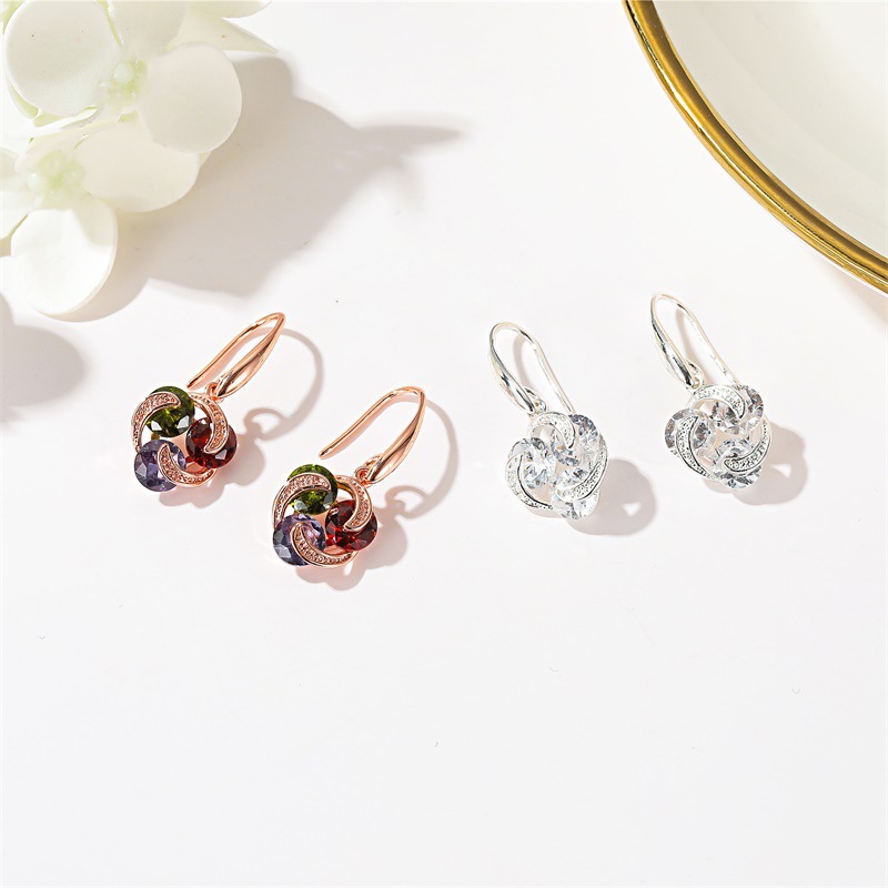 New best-selling earrings with a ladylike charm: slightly set zircon earrings and simple European and American colored diamond windmill earrings for women Application Scenario