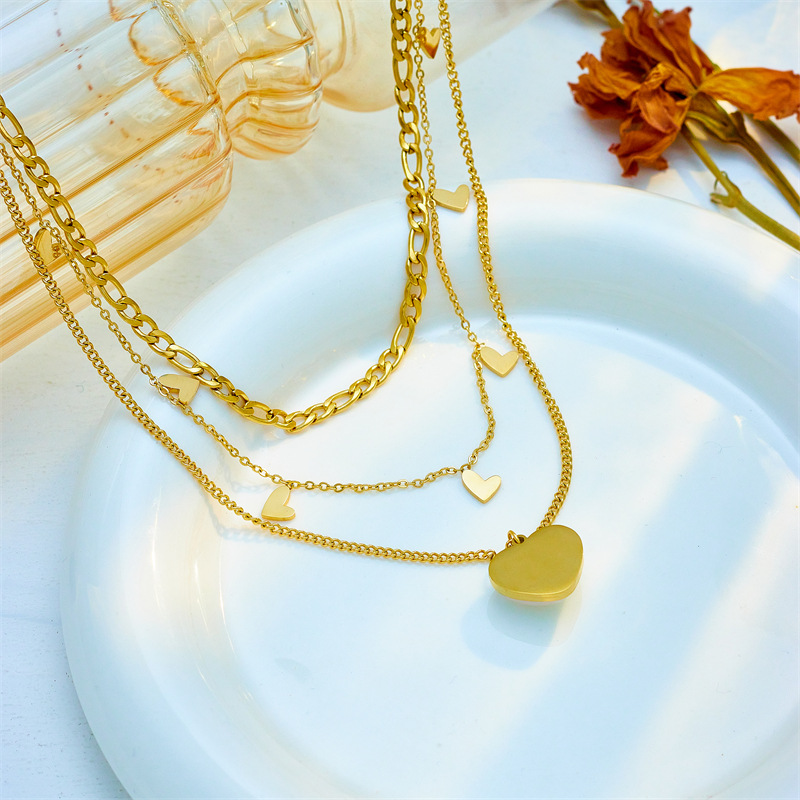 This is a versatile necklace featuring a unique and fashionable design of titanium and steel multi-layer mixed chain with a pearl and heart-shaped pendant details Picture