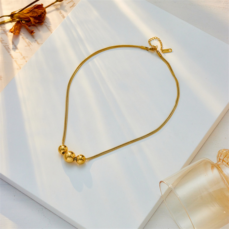 A new cross-border, simple and niche design of irregular-sized round ball beaded titanium steel metal jewelry necklace from Europe and America details Picture