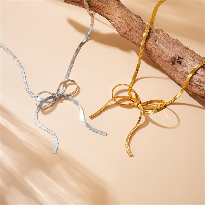 Korean-style fashionable and elegant simple gold-plated stainless steel bow snake bone chain jewelry necklace full figure