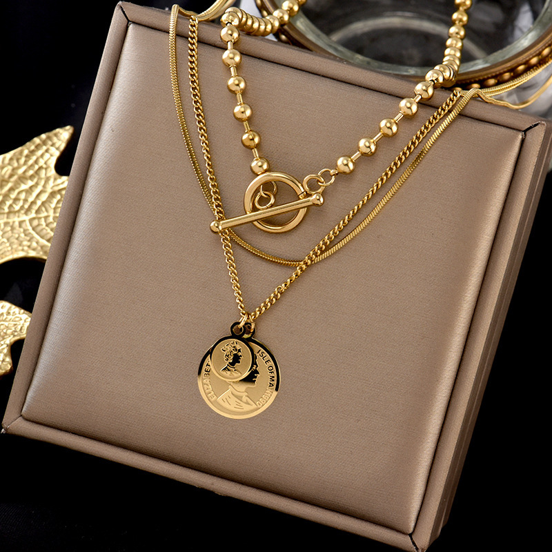 A cross-border retro multi-layer pendant with a round tag and a woman's head, OT clasp, titanium steel metal, light luxury and niche necklace full figure
