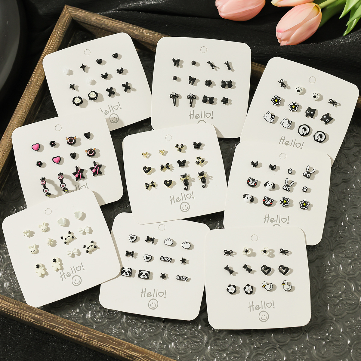 New black style, simple and elegant stud earrings, cute cartoon, versatile student earrings, niche design sense earrings for women wholesale full figure