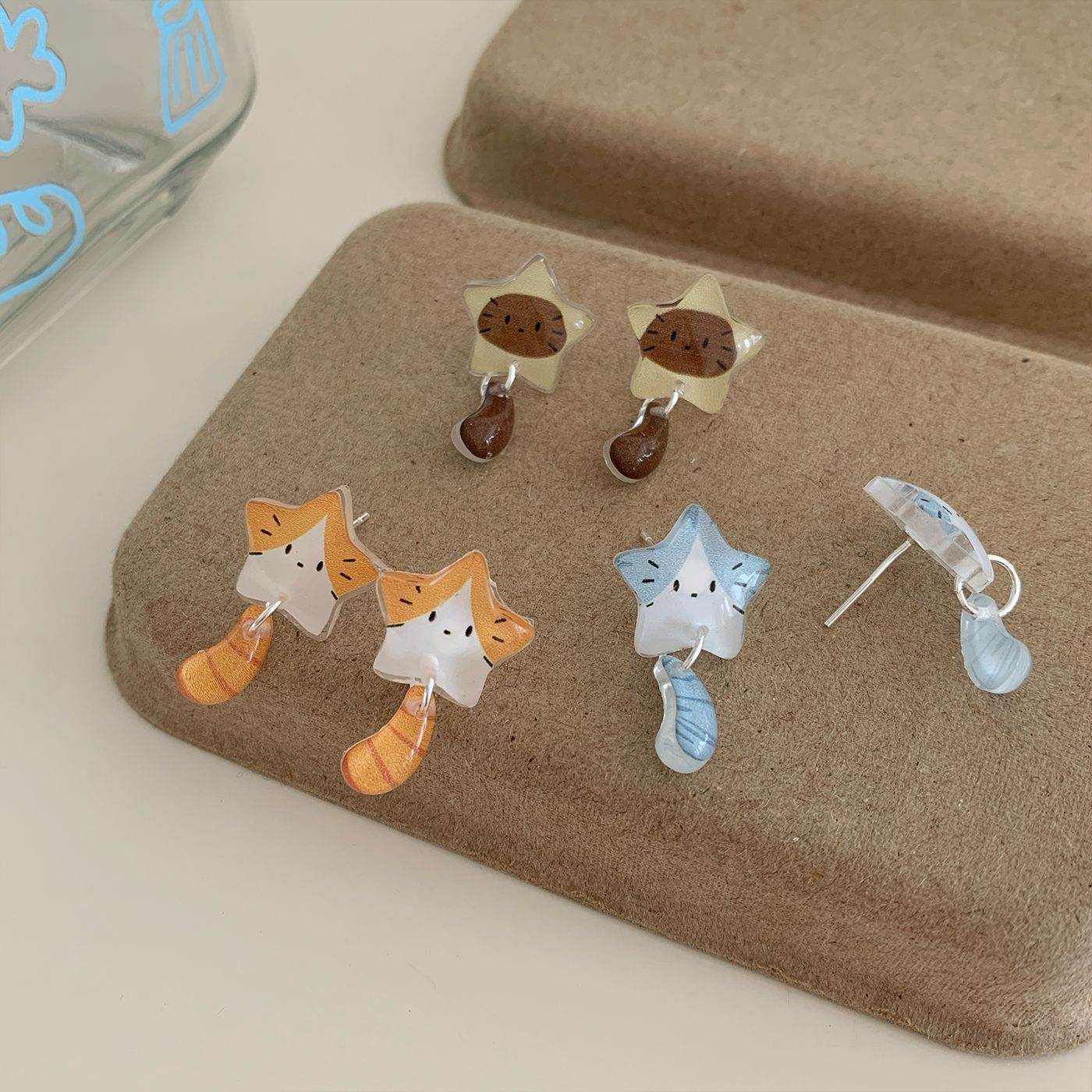 Summer resin Star Cat tail earrings for girls, silver needle, cartoon cute design, cartoon three-dimensional student earrings Application Scenario