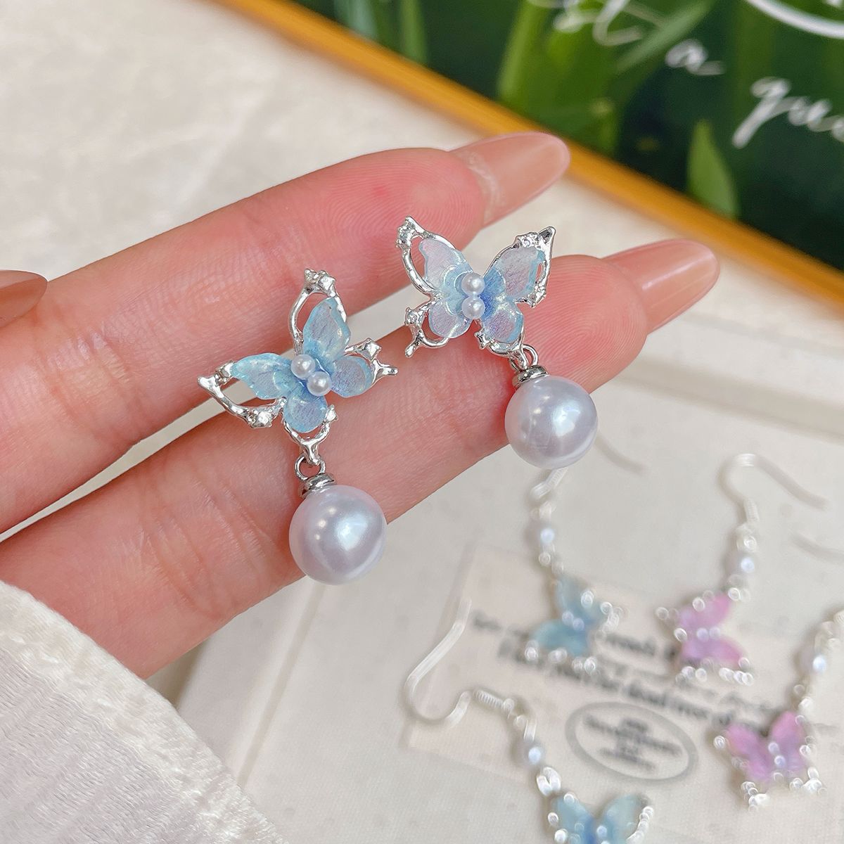 Sweet and three-dimensional pink butterfly ear hook women's niche, light luxury, ethereal tassel pendant, fresh summer earrings wholesale details Picture