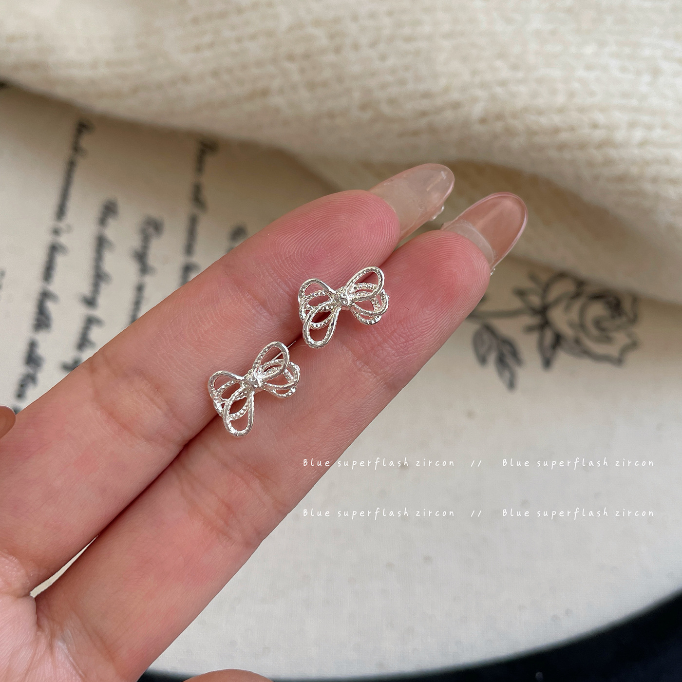 Silver small twisted rope knot bow stud earrings, women's silver needle design, simple and elegant daily wear, versatile earrings full figure