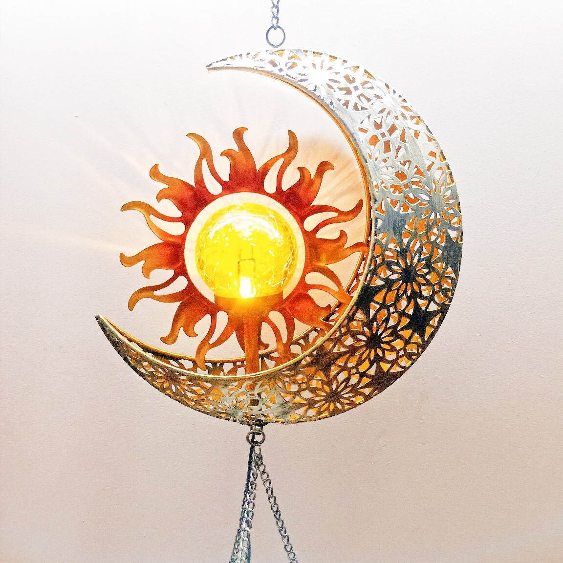 Amazon's new ironwork led solar energy sun moon wind bell pendant is in stock at the factory Application Scenario