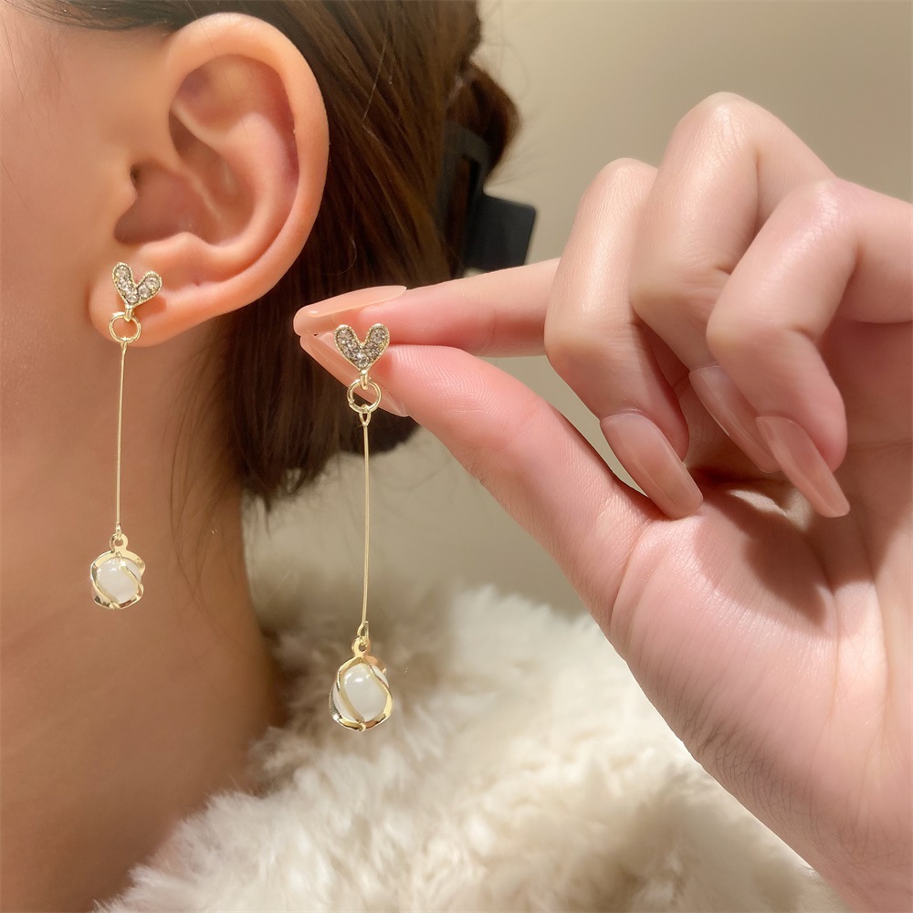 European and American ins cat's eye stone earrings, women's fashionable and elegant long star tassel earrings, creative and popular teardrop earrings details Picture