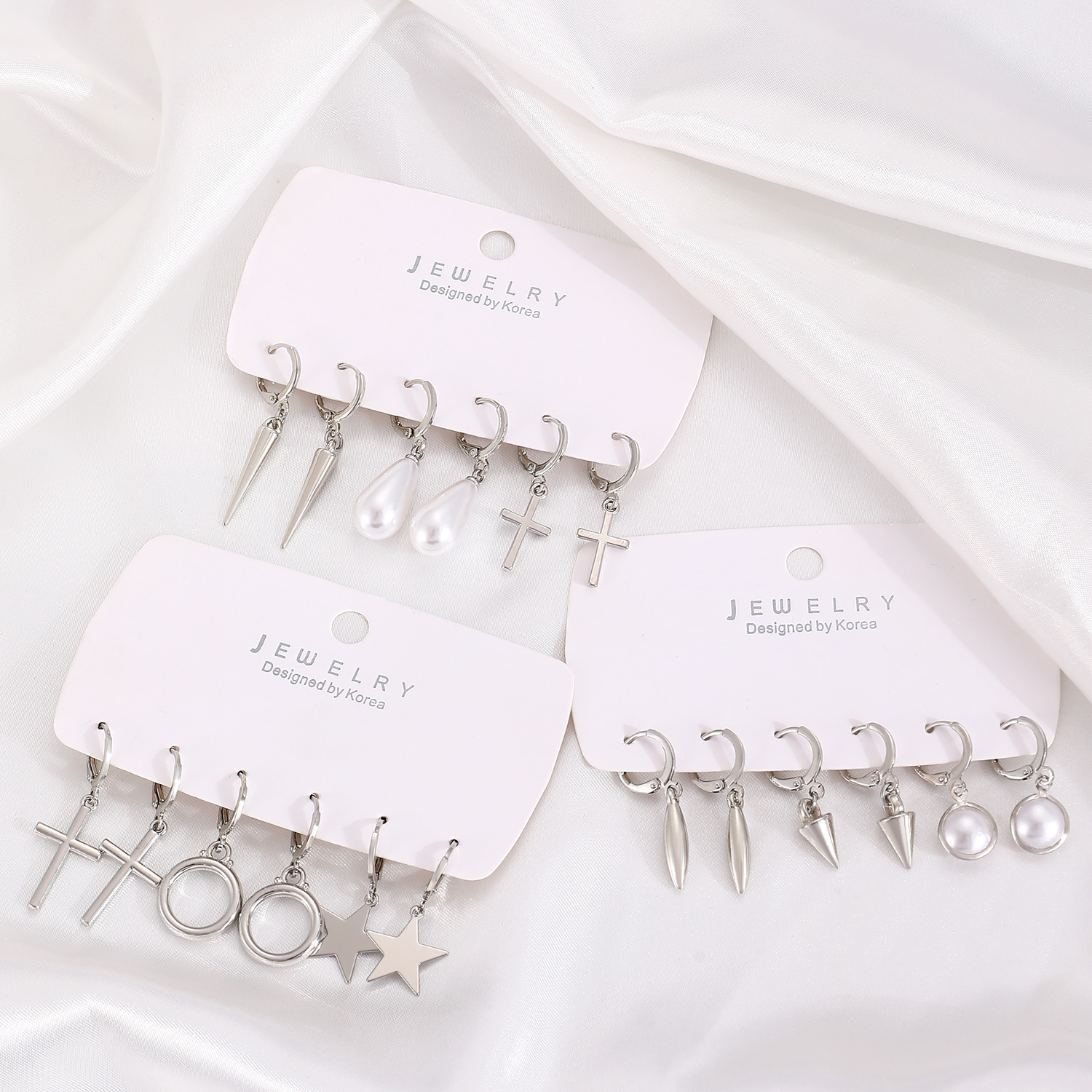 European and American cross-border earrings, fashionable and simple ear ring and ear buckle set, pointed cone rivets, water drop cross, star earrings for women full figure