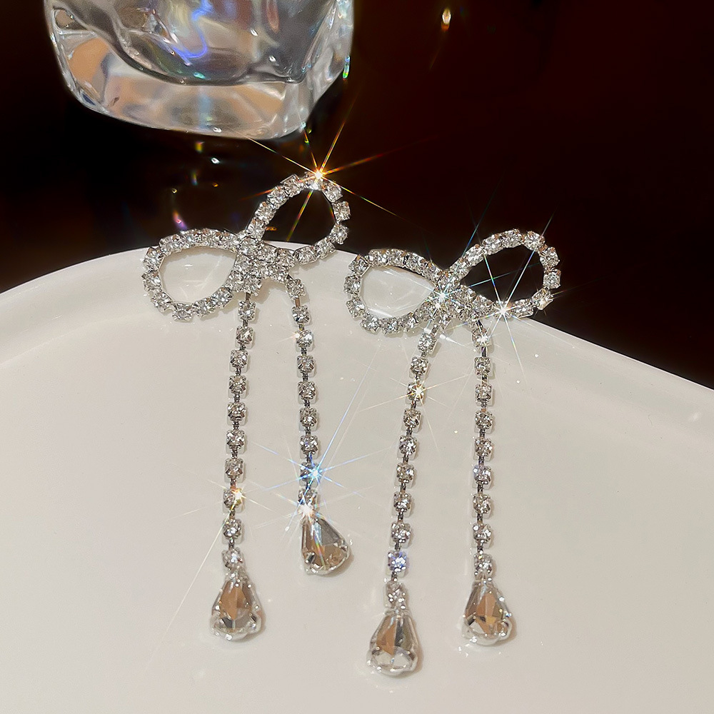 The new Korean-style exaggerated bow earrings exude a niche and high-end vibe, with a cold and simple long full-diamond earrings for women Application Scenario