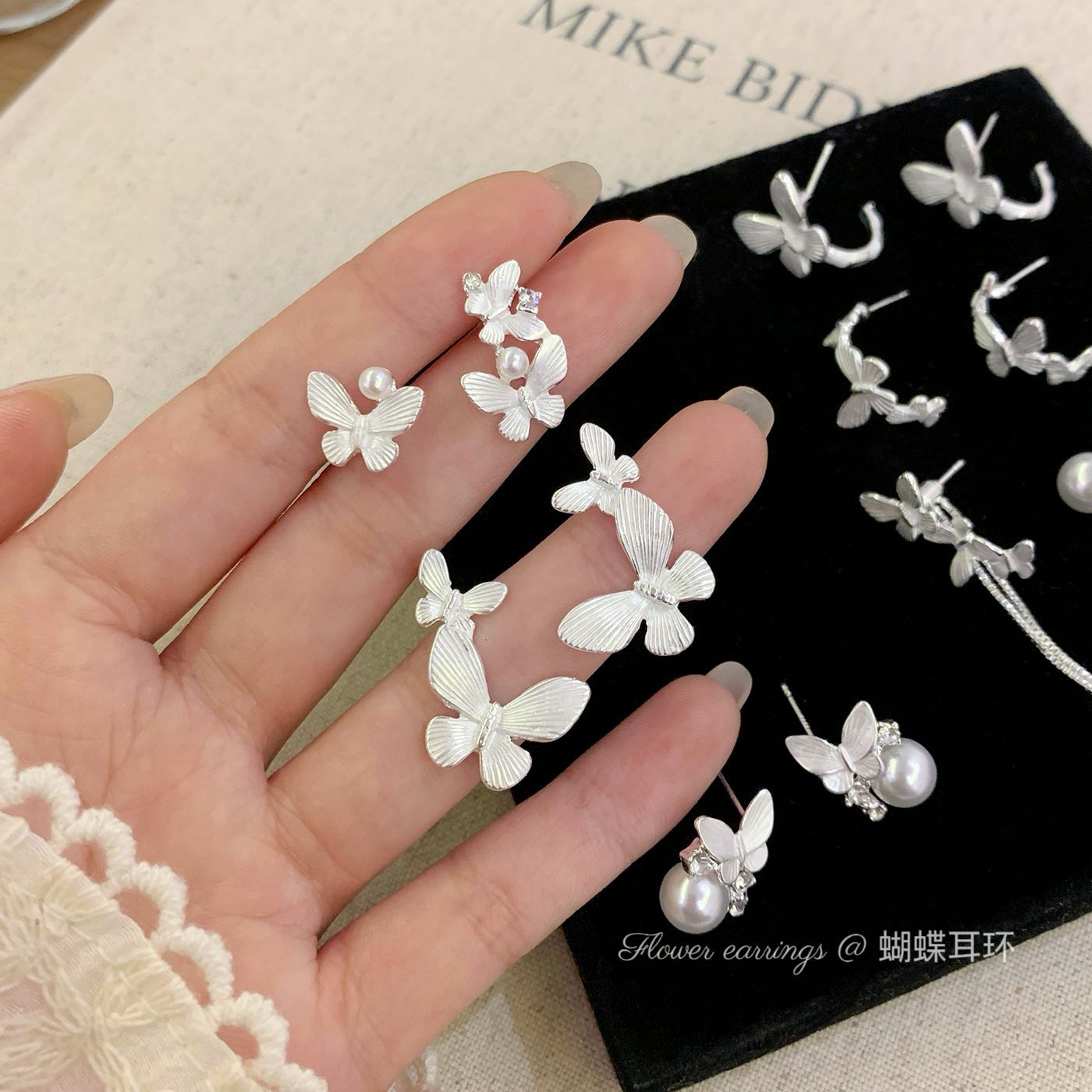 A collection of Korean-style ethereal silver butterfly stud earrings, simple and versatile silver needles for women, elegant and high-end fringed insect earrings full figure