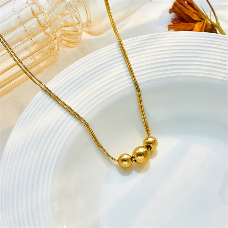 A new cross-border, simple and niche design of irregular-sized round ball beaded titanium steel metal jewelry necklace from Europe and America Specification drawing