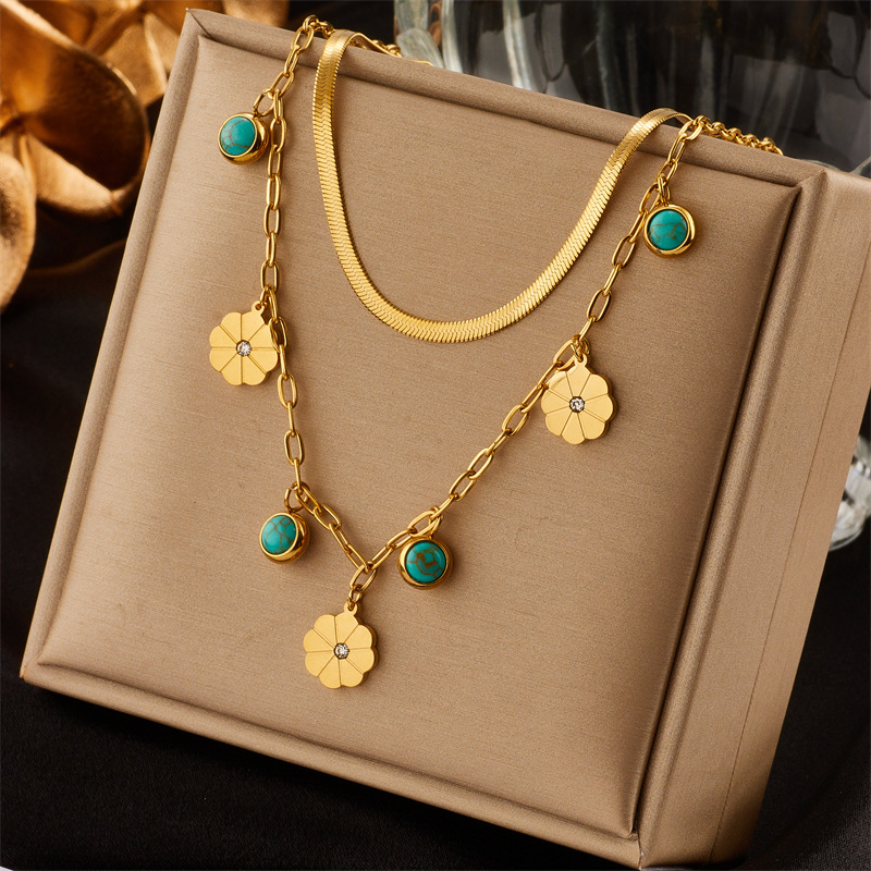A cross-border fashionable and simple double-layer snake bone chain titanium steel turquoise small flower pendant accessory necklace from Europe and America full figure