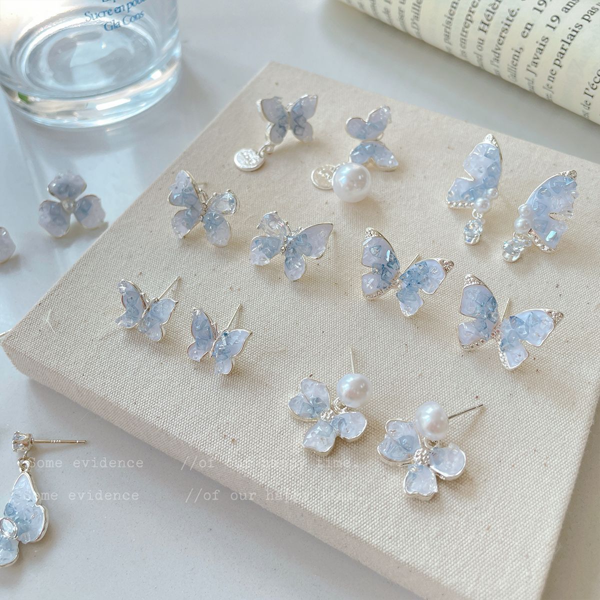 Blue bow crystal earrings, women's design sense earrings, stud earrings, silver needle earrings, ins earrings, high-end and light luxury full figure