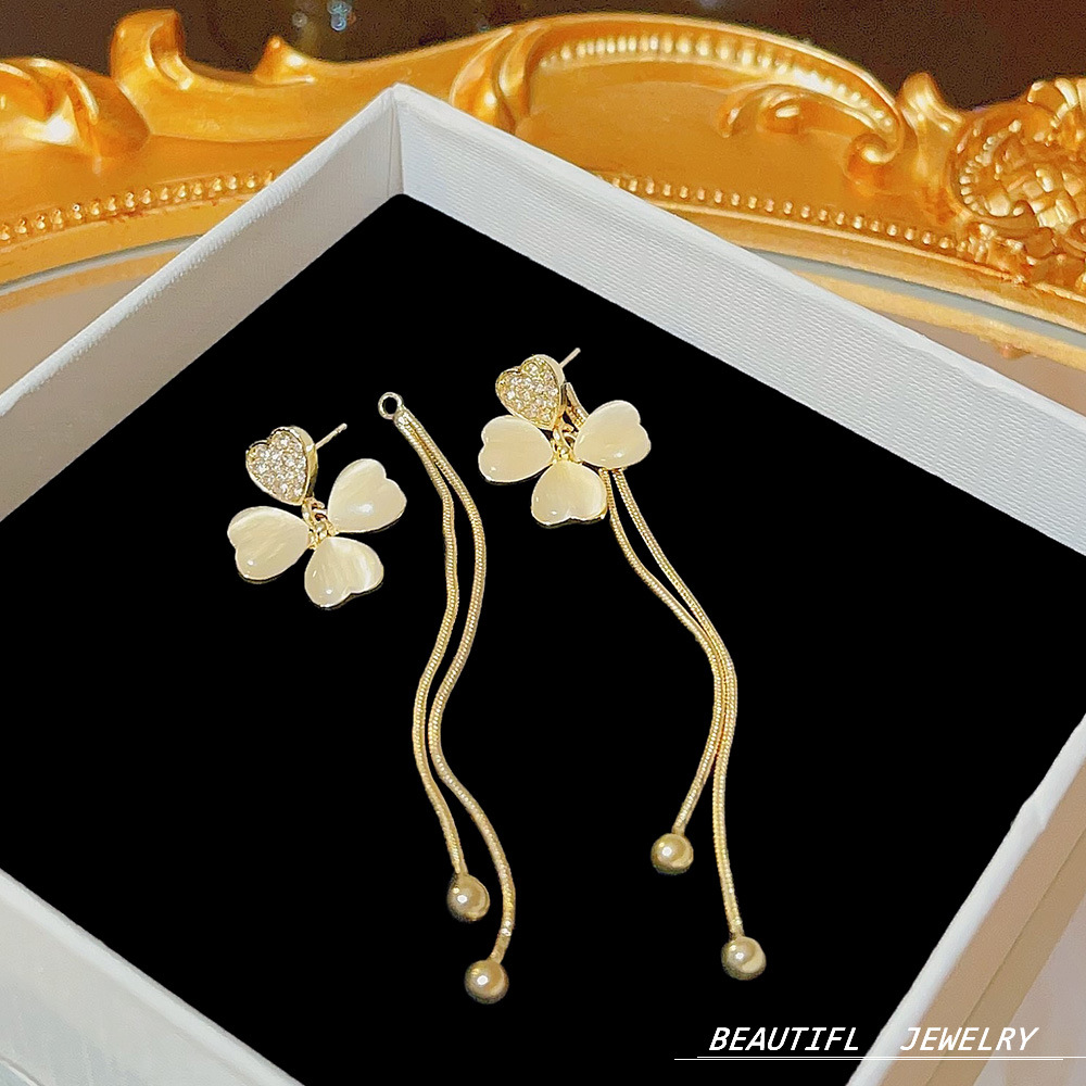 Elegant long cat's eye stone petal earrings for women, high-end and versatile ear studs for autumn and winter, light luxury and stylish Suzhou earrings wholesale details Picture