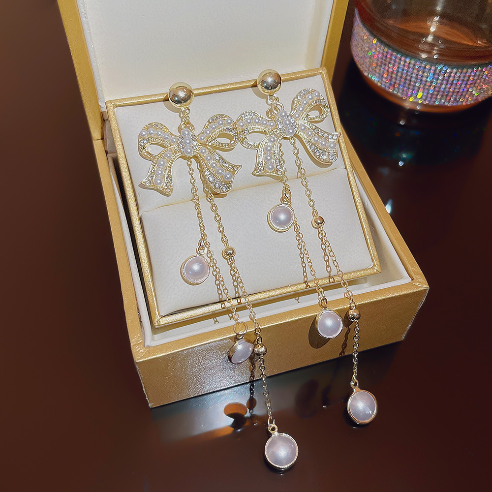 Korean style fashion socialite style pearl full diamond bow earrings with tassels, high-end long and exquisite earrings for women wholesale full figure