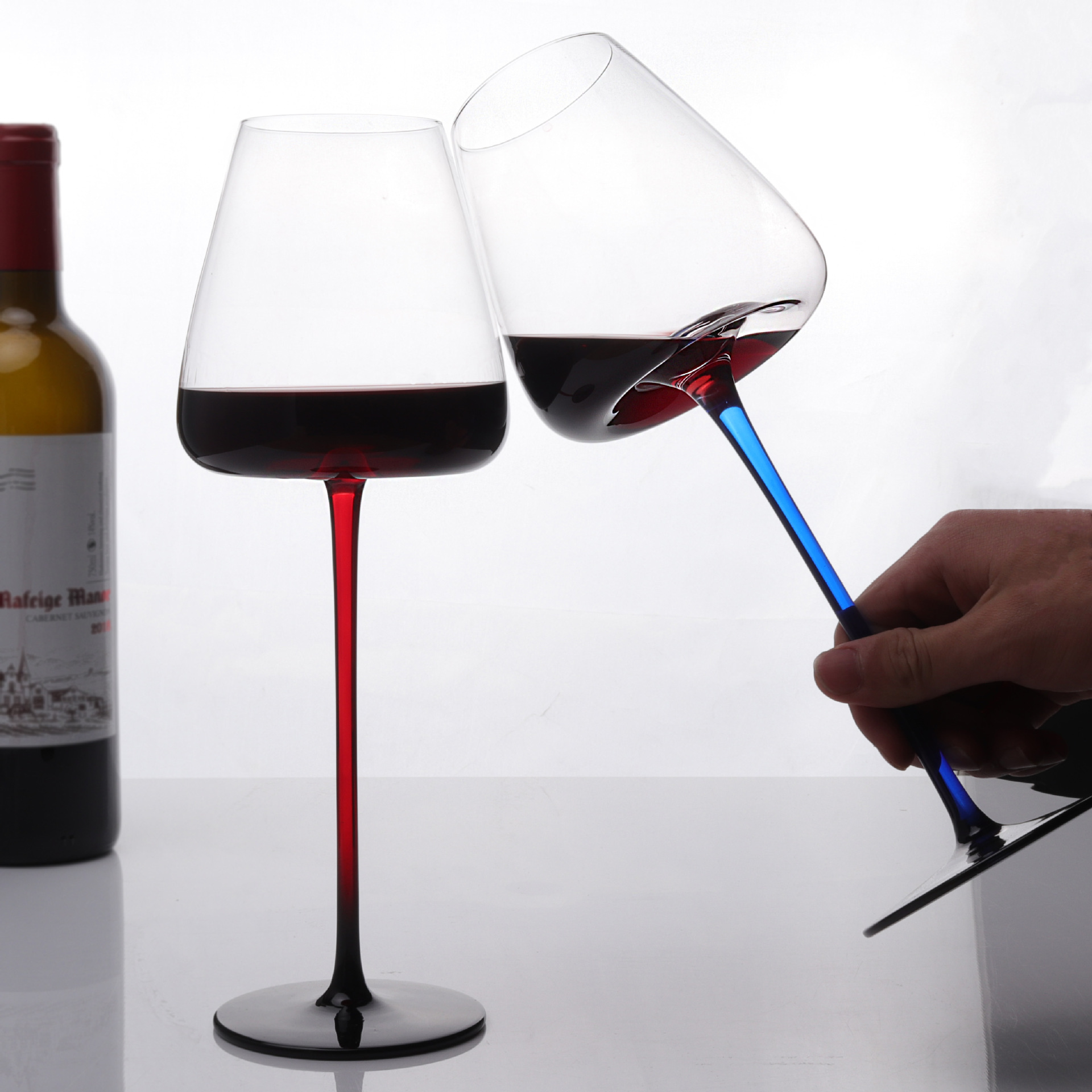 A variety of large Burgundy household red stem, black bottom, concave bottom red wine glasses, champagne glasses, black bow tie, and crystal red wine glasses full figure