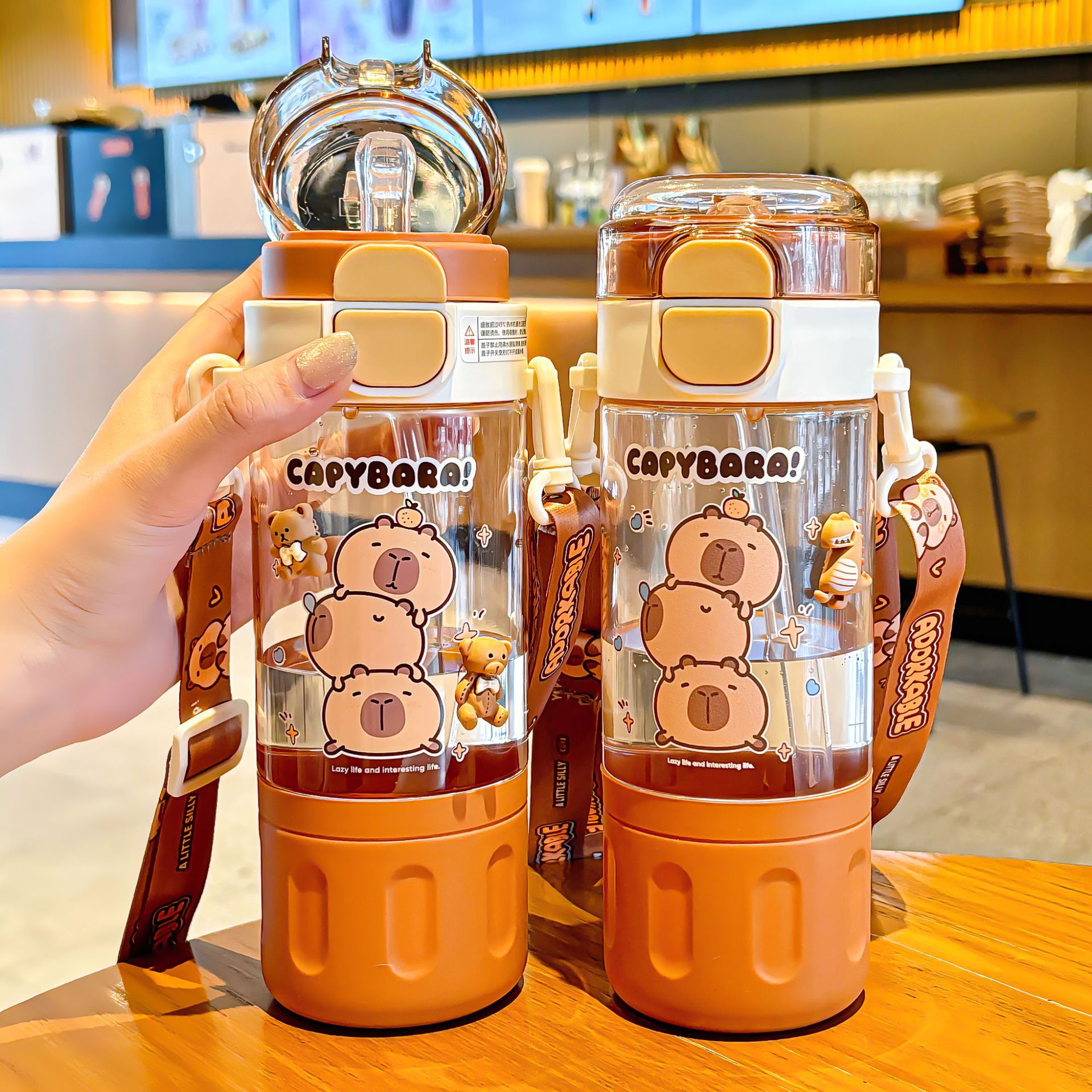 Capibala double-drinking plastic cup, convenient pop-up lid water cup, cartoon children's creative straw cup, girls' portable cup Application Scenario