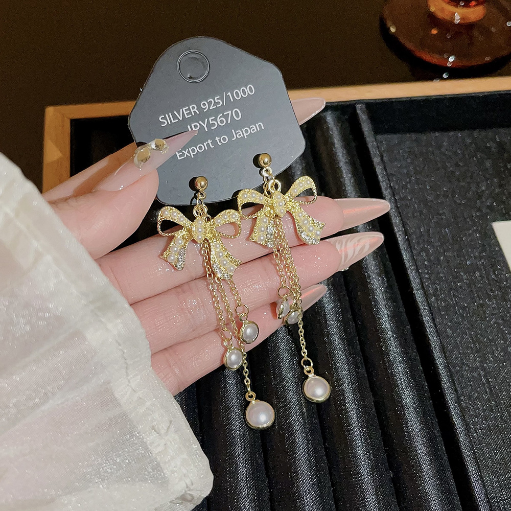 Korean-style long bow tassel earrings, high-end autumn and winter earrings, versatile and elegant pearl stud accessories for women full figure