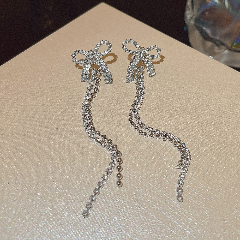 S925 Silver Needle Super Shiny, simple and fashionable bow earrings, niche high-end, trendy design, long earrings wholesale Specification drawing