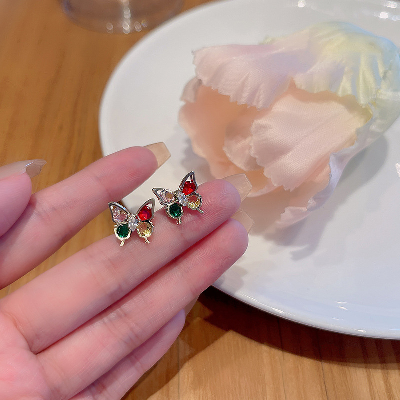 S925 Silver Needle, a new Korean colorful butterfly zircon earring, exudes a high-end feminine charm. It is exquisite, compact and versatile full figure