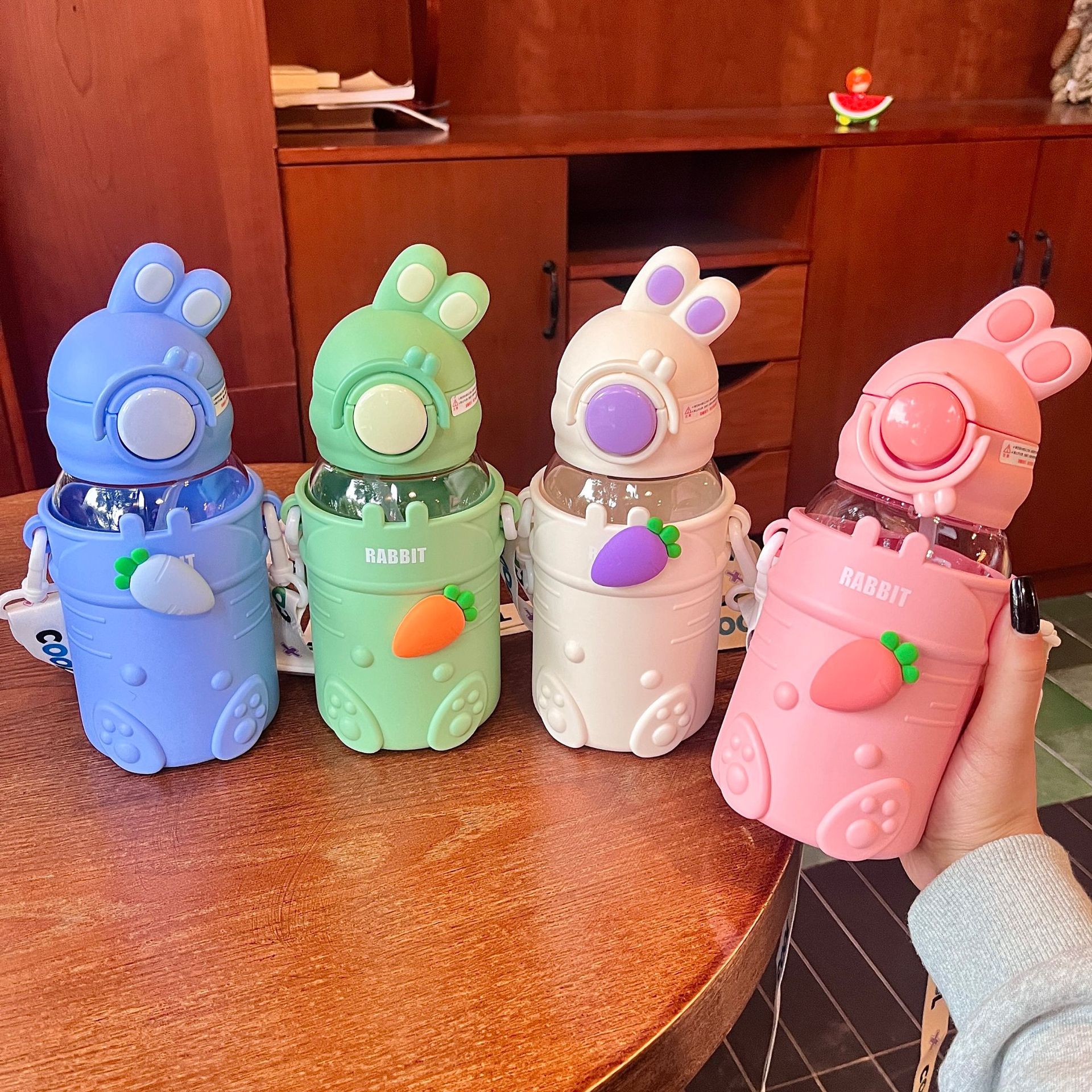 Cute tilted head rabbit plastic cup, children's cup, portable water cup, high appearance level, high-temperature resistant, summer bouncy cup full figure