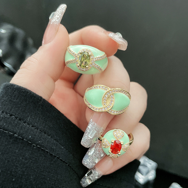 The new Mambo style mint green and gold open-top ring is a fashionable and niche design for women, exuding a sense of high-end luxury and a touch of light elegance full figure