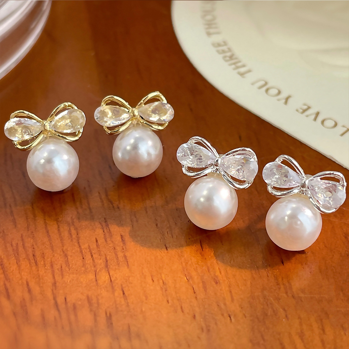 Exquisite and light luxury bow zircon pearl stud earrings, women's silver needle, simple and elegant, versatile and high-end summer earrings Specification drawing