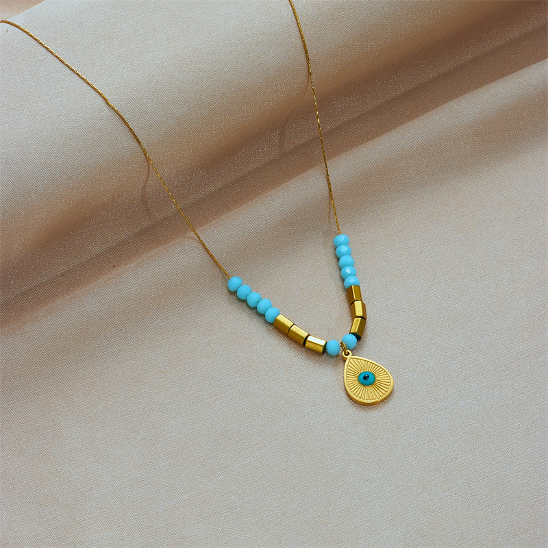 European and American cross-border fashion, simple, niche and retro blue eye water drop pendant, cut surface beaded titanium steel chain necklace details Picture