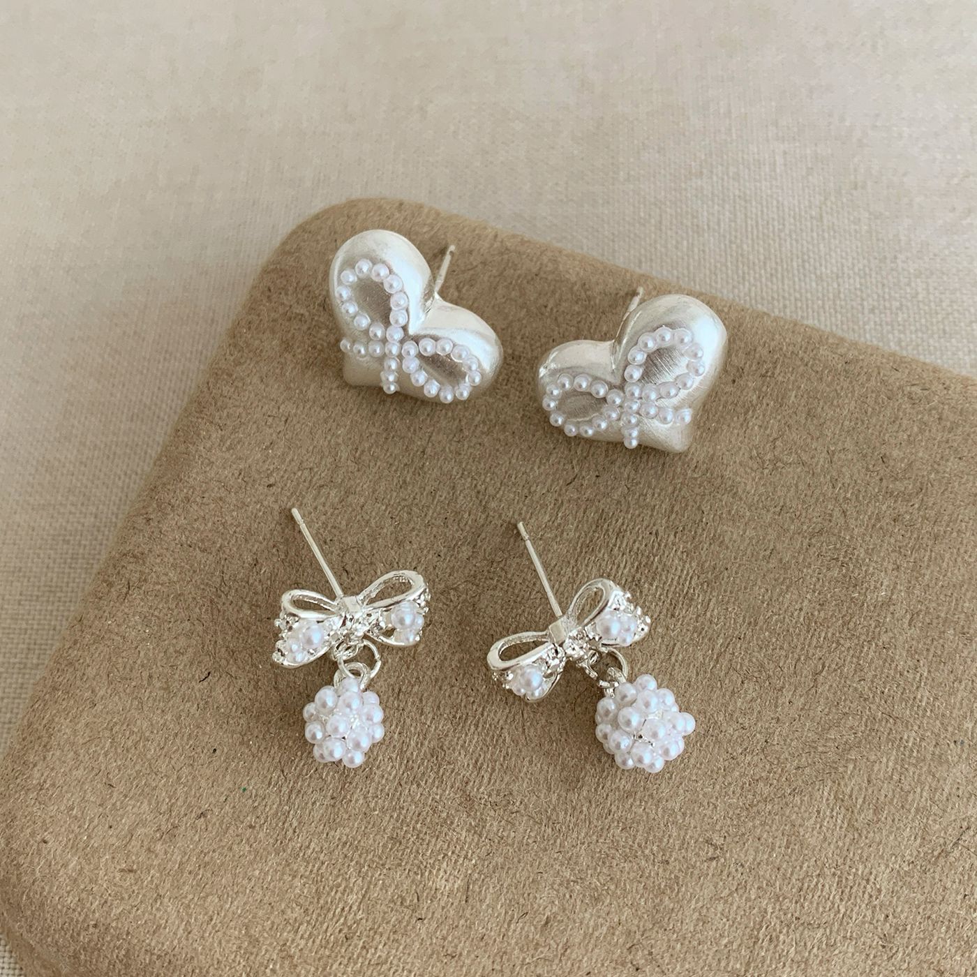 Spring Korean-style light luxury brushed pearl flower ball bow earrings, women's silver needle exquisite and high-end fashionable earrings Application Scenario