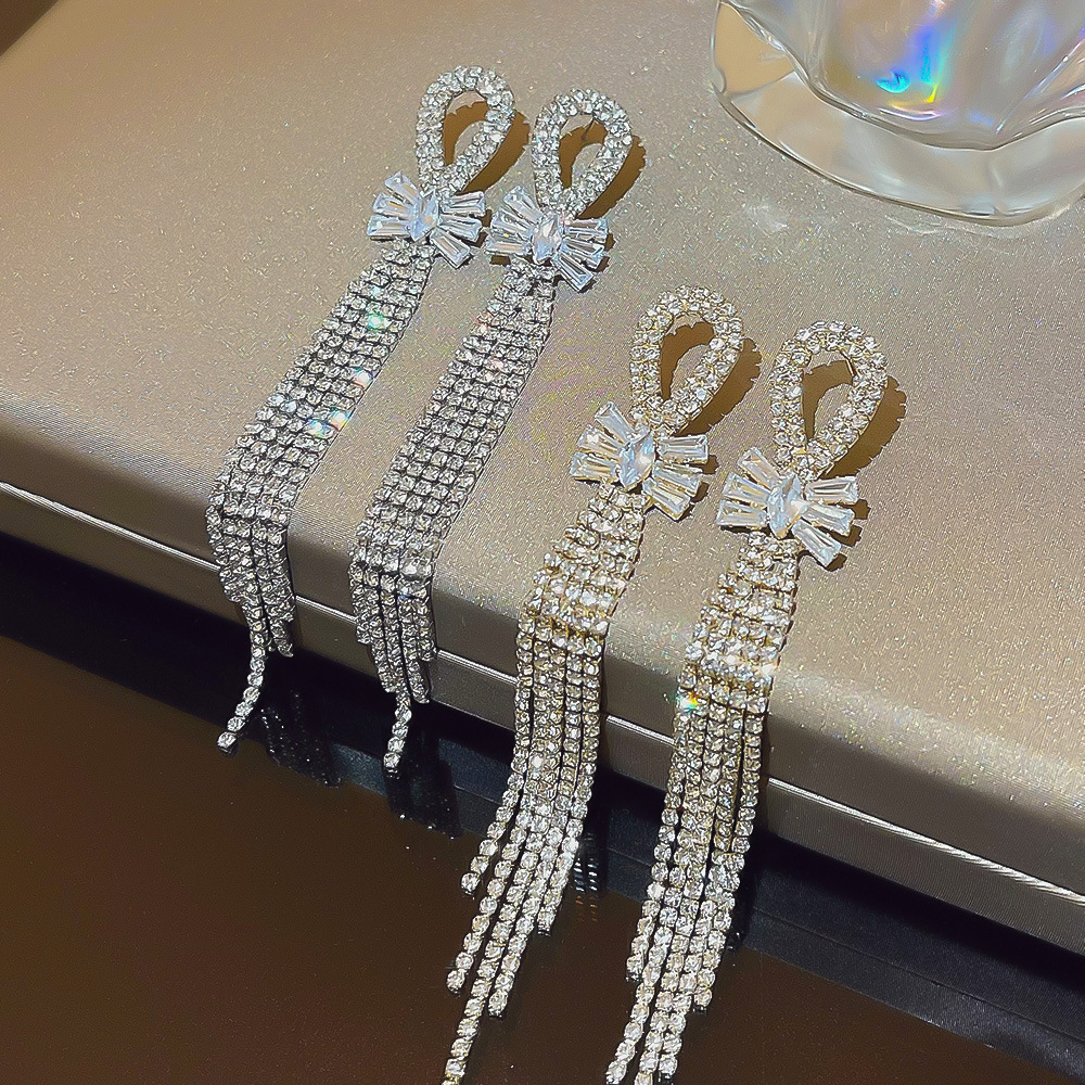 Wholesale of cross-border fashion exaggerated bow tassel earrings and accessories for women, with a light luxury and high-end feel, and a cold style full figure