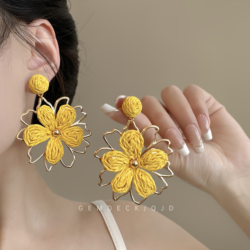 Seaside vacation style woven sunflower stud earrings, exaggerated and unique design sense earrings, unique travel photo earrings for women details Picture