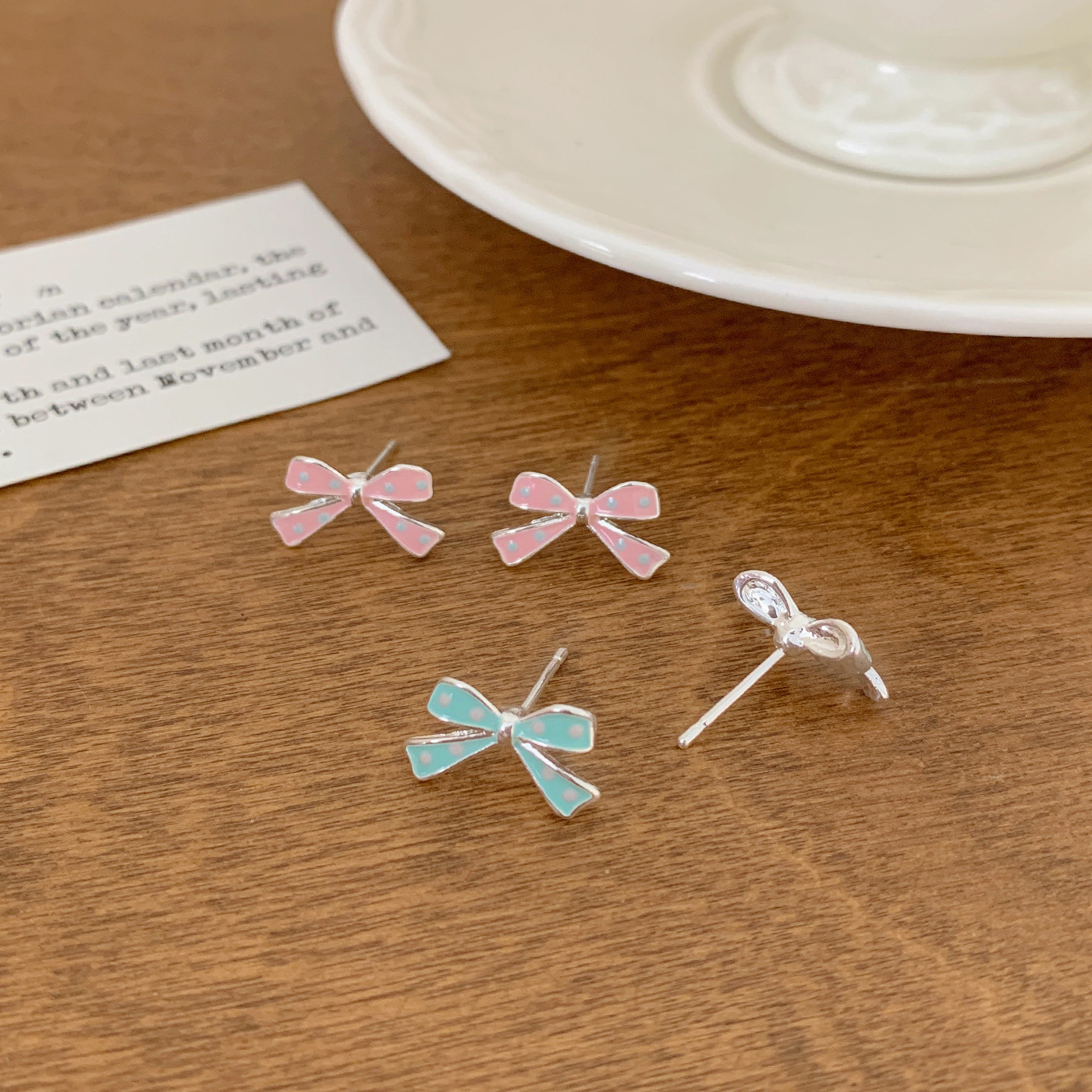 Korean sweet oil-dripping polka dot bow stud earrings, small and simple new style, versatile and girlish heart earrings Application Scenario